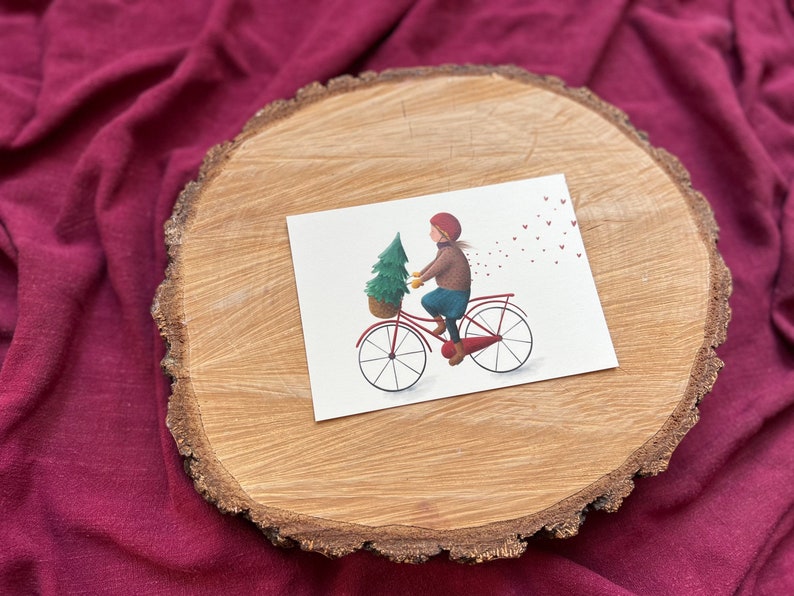 Postkarte „Dezembergefühle“ | eine besondere, liebevoll illustrierte Karte für alle, die Winter, Weihnachtsbäume und Fahrräder lieben.