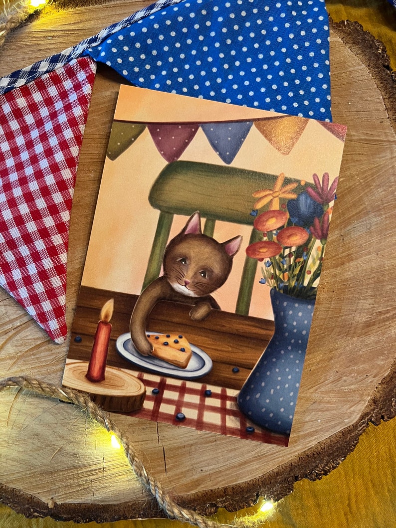 Postkarte "Kuchenkatze" | Ein fröhliches-warmes Motiv für Katzenfans, große und kleine Geburtstagskinder und alle, die Kuchen lieben.