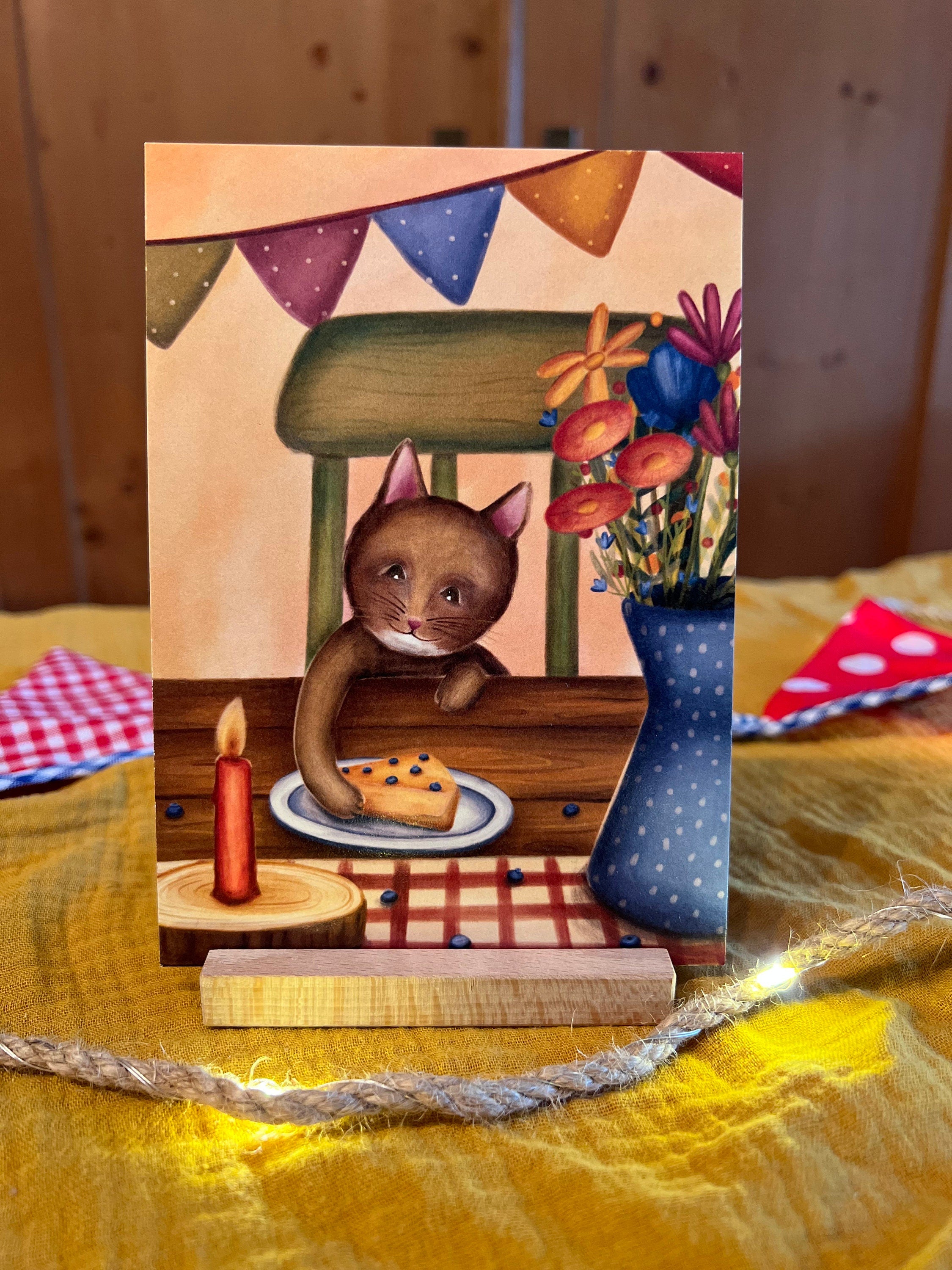 Postkarte "Kuchenkatze" | Ein fröhliches-warmes Motiv für Katzenfans, große und kleine Geburtstagskinder und alle, die Kuchen lieben.